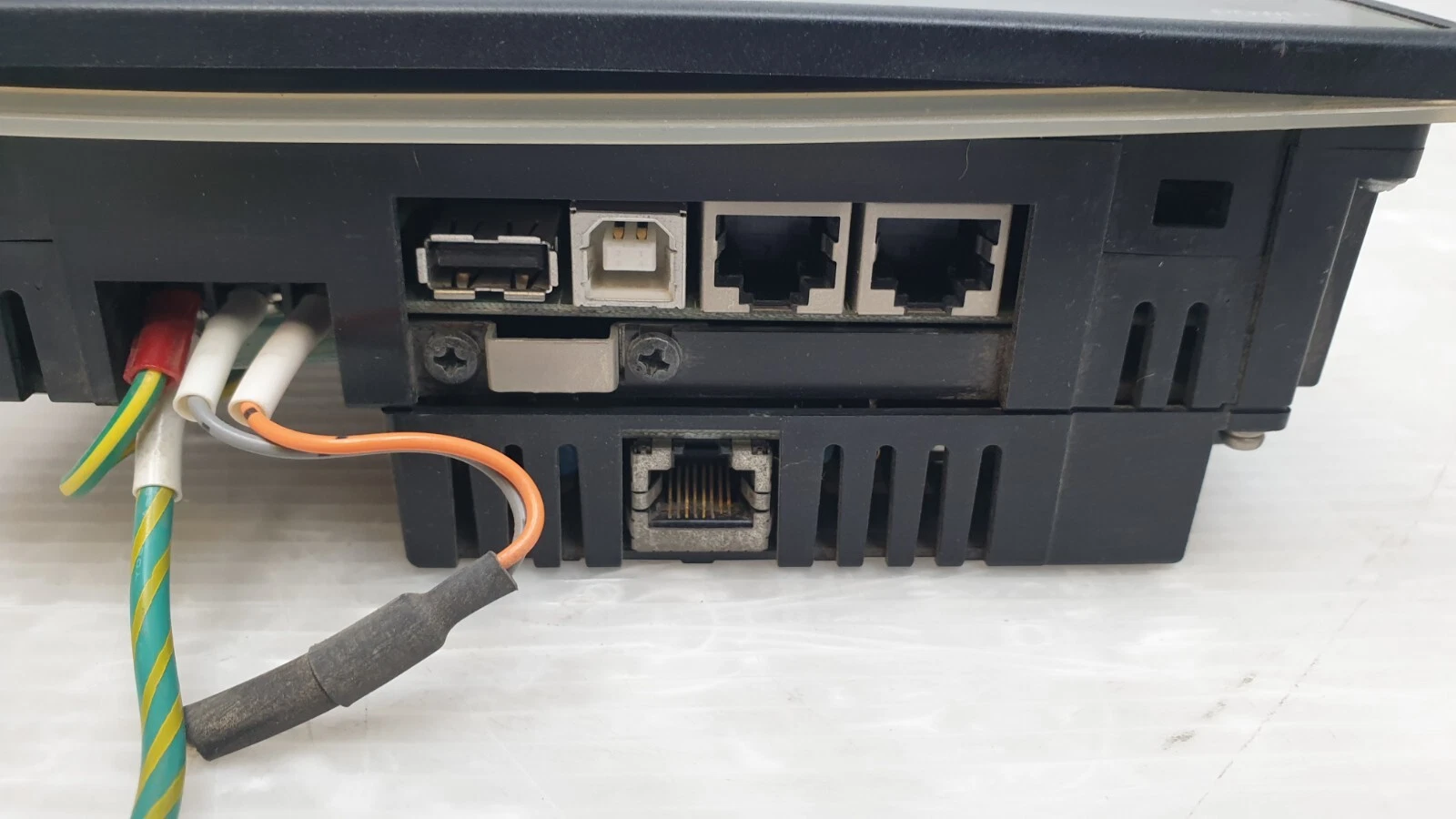 USB and RJ-45 ports and power leads on the Fuji UG230 panel