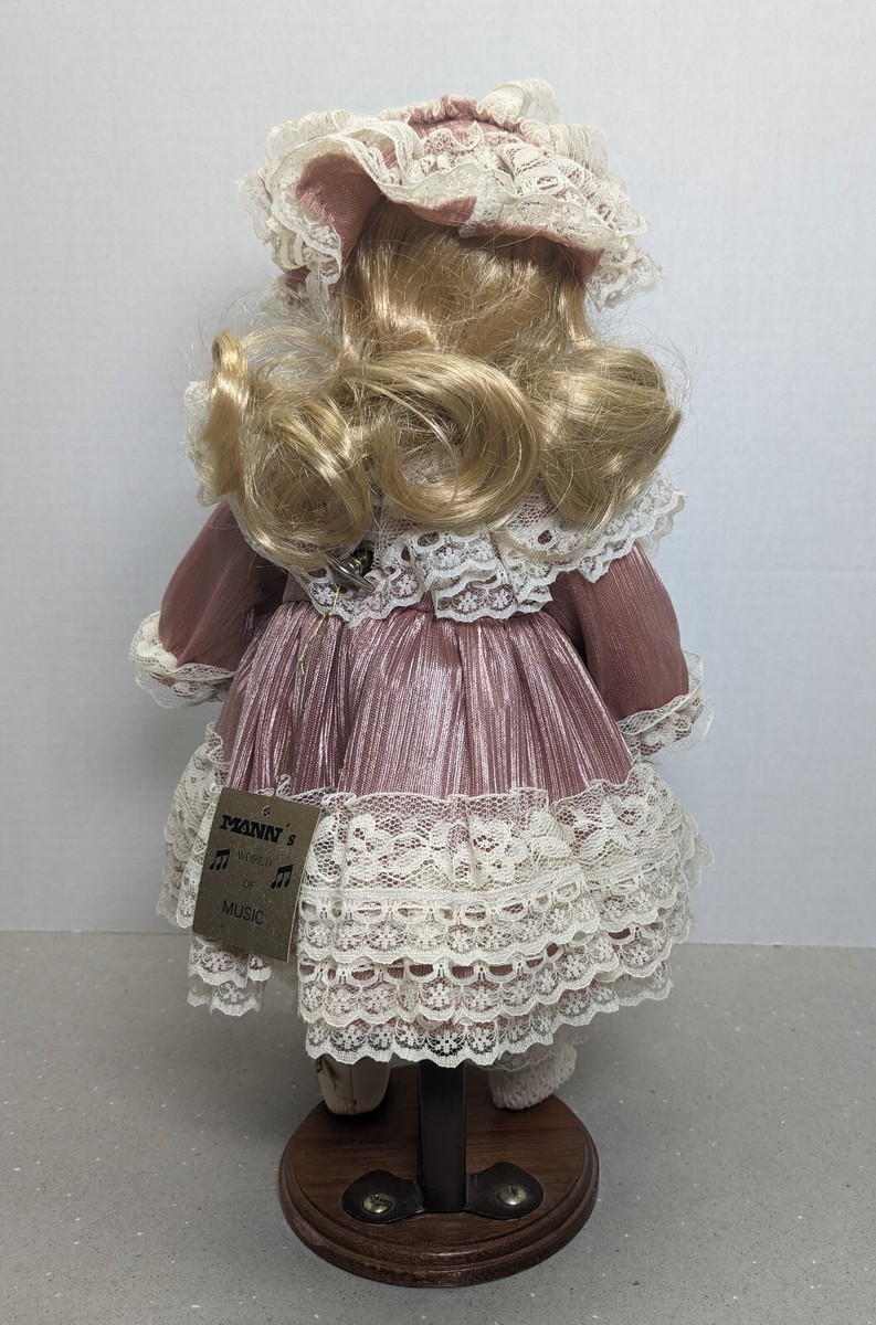 Mann's World of Music MUSIC BOX DOLL porcelain , blonde, blue eyes