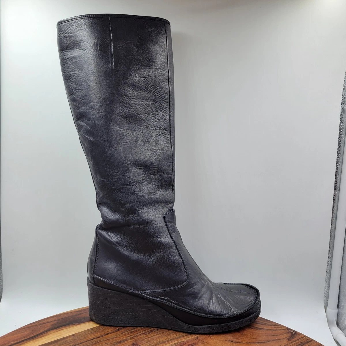 Knee high best sale leather wedge boots