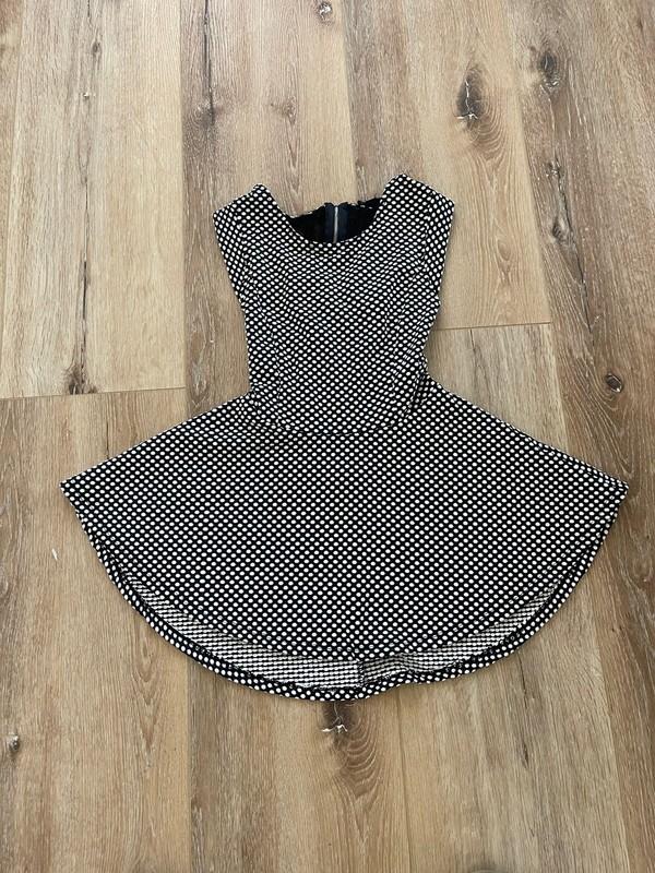 black and white flare top with lace and zipper  on the back  size small