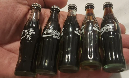 Lot 5 Coca Cola Mini 3" Filled Glass Bottles Metal Caps Vintage 1980s & Keychain