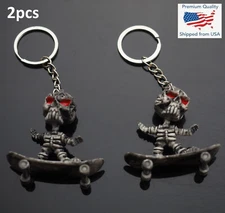2pcs - Skeleton Man Riding a Skateboard Charm Bones Skull Keychain Funny Gift