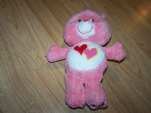pink care bear with two hearts