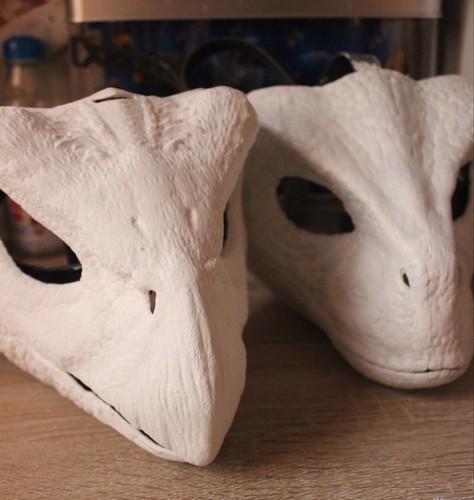 Two White Painted Dinosaur Masks (See description)