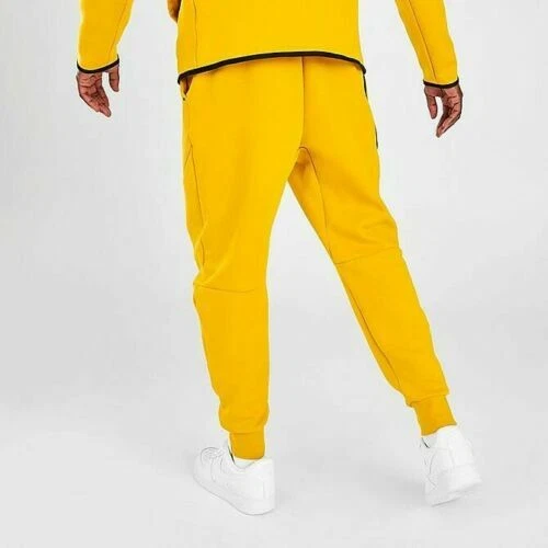Nike tech shop fleece pants yellow