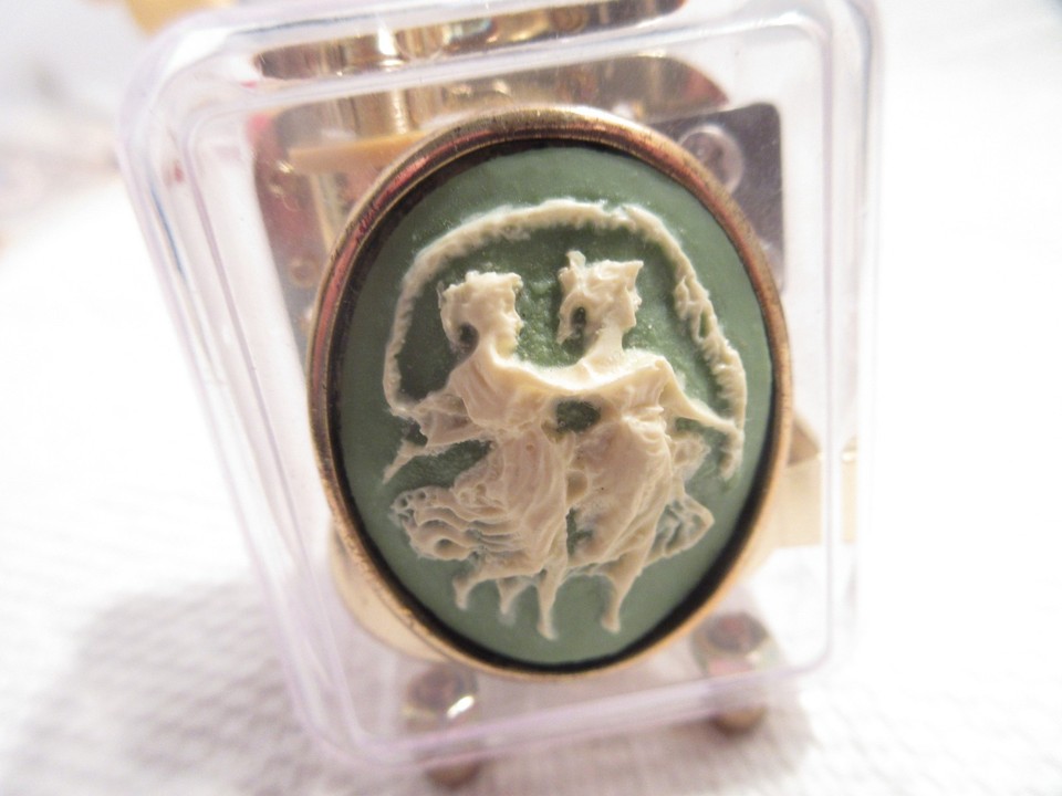 A lucite music box with a faux cameo of dancing fairies playing Für Elise — pure 1970s kitsch magic in a see-through case.
