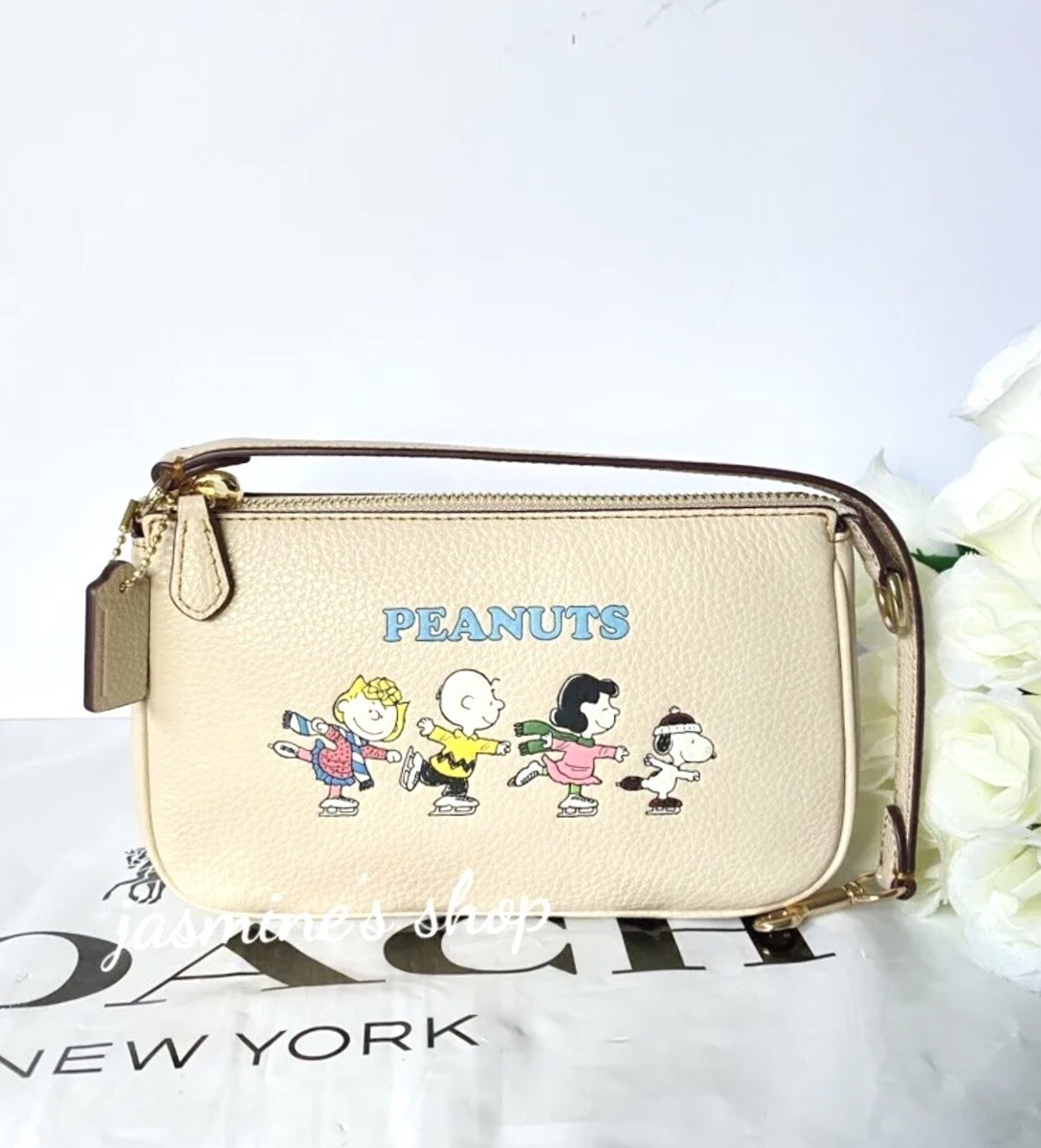 国内即送COACH X PEANUTS スヌーピー ノリータ 19 ポーチ CE858 NWT Coach X Peanuts Nolita 19 With Snoopy And Friends Motif