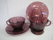 DURALEX FRANCE AMETHYST GLASS SWIRLED PATTERN PAIR OF CUPS AND SAUCERS