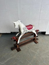 A mid 20th century painted wooden rocking horse