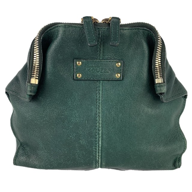 green leather clutch
