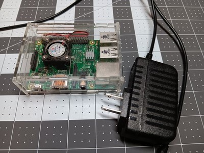 Raspberry Pi 2b w power supply in case w heat sinks.