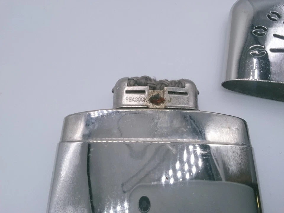 Calentador de manos cromado marca Peacock hecho en Japón Foto 4 de 4