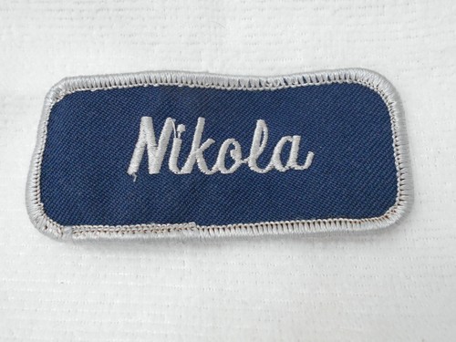 NIKOLA USED EMBROIDERED SEW ON NAME PATCH TAGS WHITE ON DARK BLUE