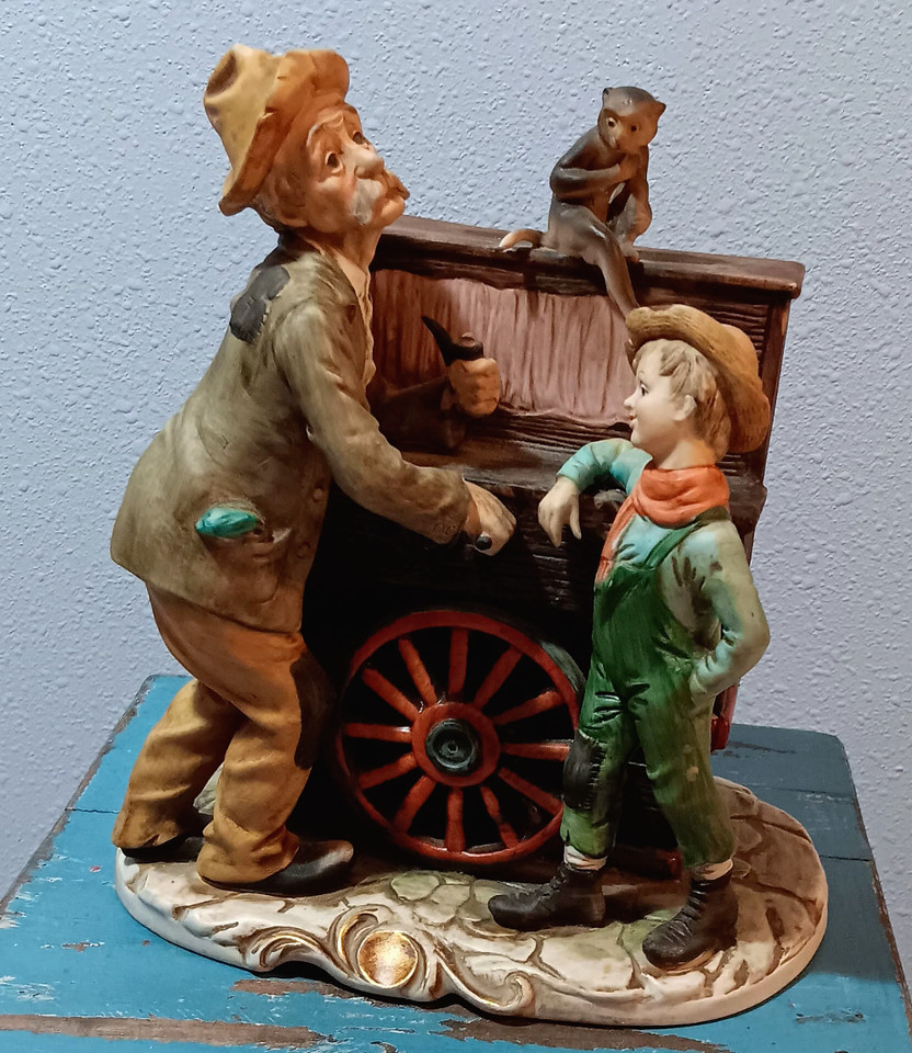 A working porcelain Organ Grinder & Monkey music box playing The Godfather theme — campy, cinematic, and utterly conversation-starting.