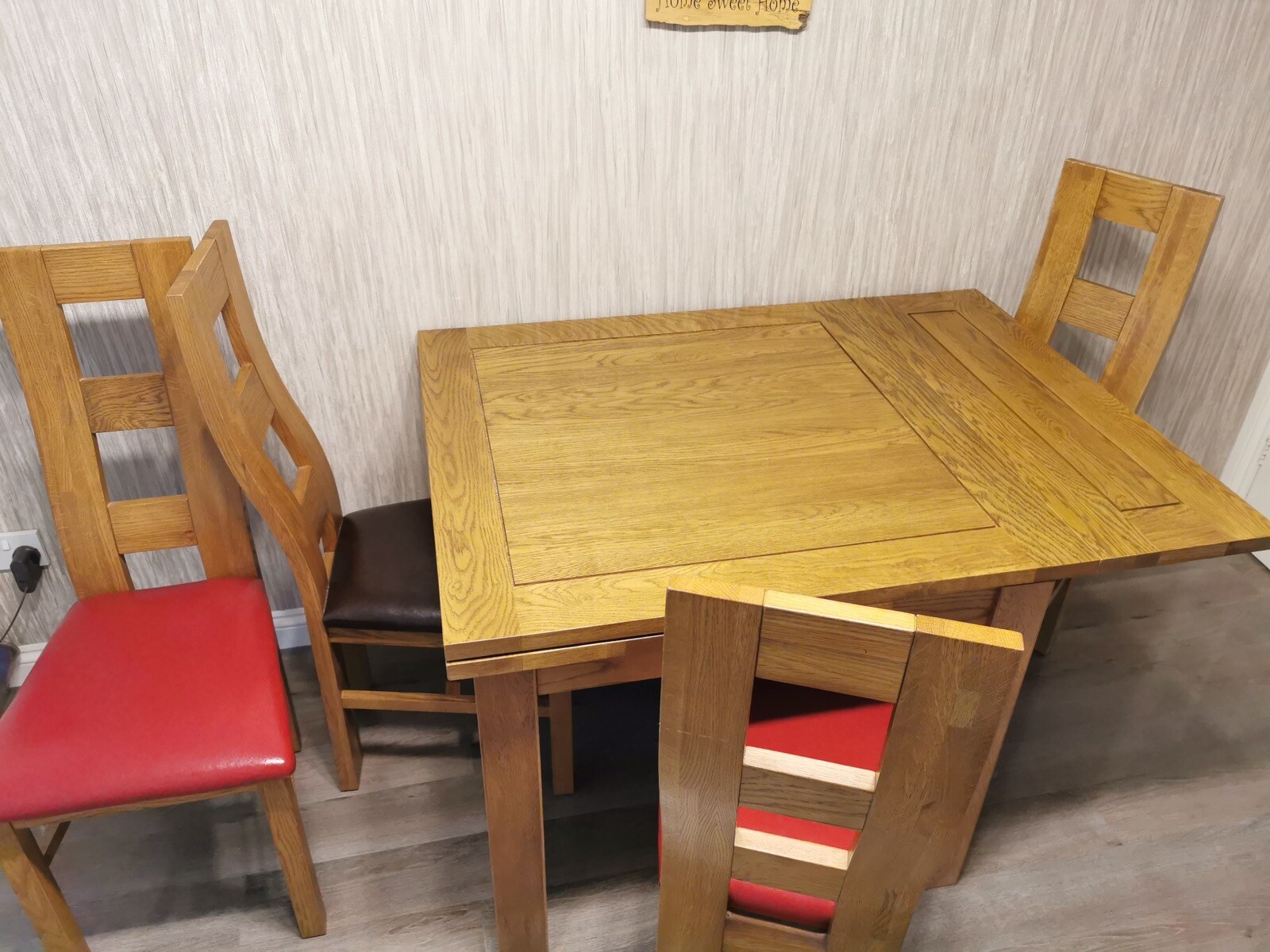 Slightly Used Oak Furniture solid oak extending dining table and 4