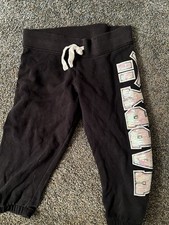 Justice black capri sweatpants with a multicolored Sequin Happy On Leg