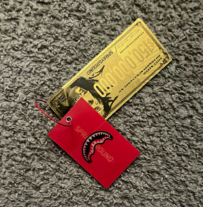 Sprayground Metal Gold Money Bill Luggage Tag w/ Red Shark Mouth, String Loop