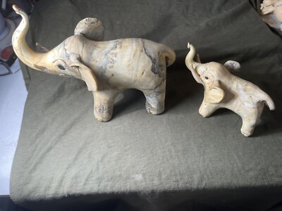 Set of 2 decorative elephants.   We are unsure of their origin or makeup.