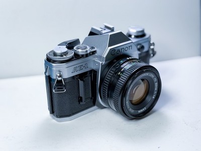 Canon AE-1 35mm Film Camera + 50mm f/1.8 Lens TESTED WORKING No Squeal + Battery