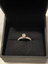 Diamond ring size 6.5 womens oval-shaped with diamonds covering 3/4 of band 