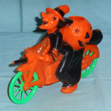 vintage original HALLOWEEN CANDY CONTAINER witch riding motorcycle