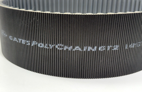 Black GATES 14MGT-994-90 Poly Chain Belt with green printed specifications and “Made in U.S.A.” text on black surface.