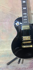 Custom black electric guitar with gold hardware. Shipped from the USA.