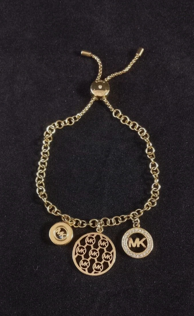 Bracciale Michael Kors tono oro zirconi strass charm catena scorrevole