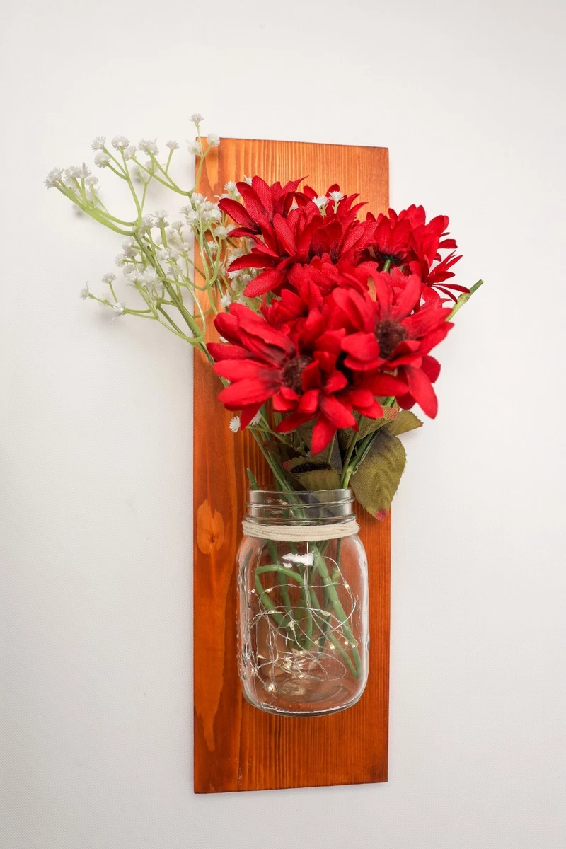 Mason jar with 2024 lights and flowers