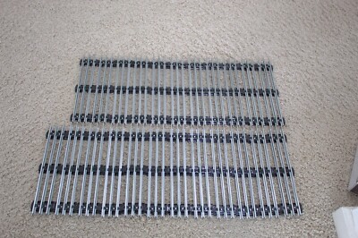 Twenty Three Pieces of O Scale Gauge, Black Ties, Tubular 10-inch Straight Track