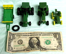 LOT OF 3 JOHN DEERE TRACTORS 2 MARKED ERTL  1MAJORETTE WAGON  TIRE