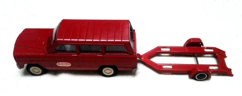 Red 1960's 9 inch Tonka Jeep Wagoneer with car hauler trailer