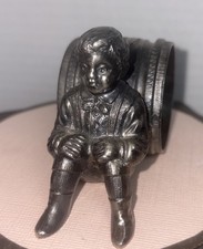 Figural Napkin Ring, A Young Boy Sitting, Resting by the Engraved Ring Unbranded