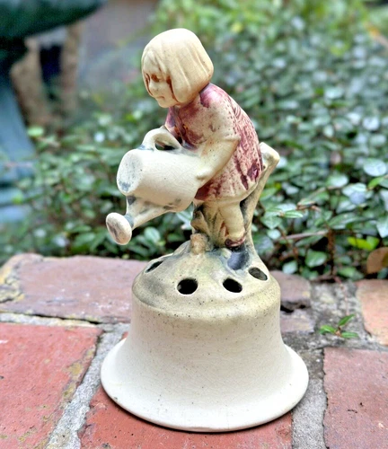WELLER POTTERY MUSKOTA FLOWER FROG OF GIRL WITH A WATER CAN....MINT!