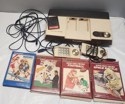 Sears Tele-Games Super Video game council with 5 games.
