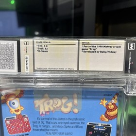 Trog! - WATA 9.8 A+ Sealed (NES 1991) Dot-Gobbling Dinos Meet NES Mayhem