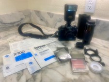 Minolta x-700 35 mm with auto winder, 50 mm f1.7 lens, zoom, filters strap