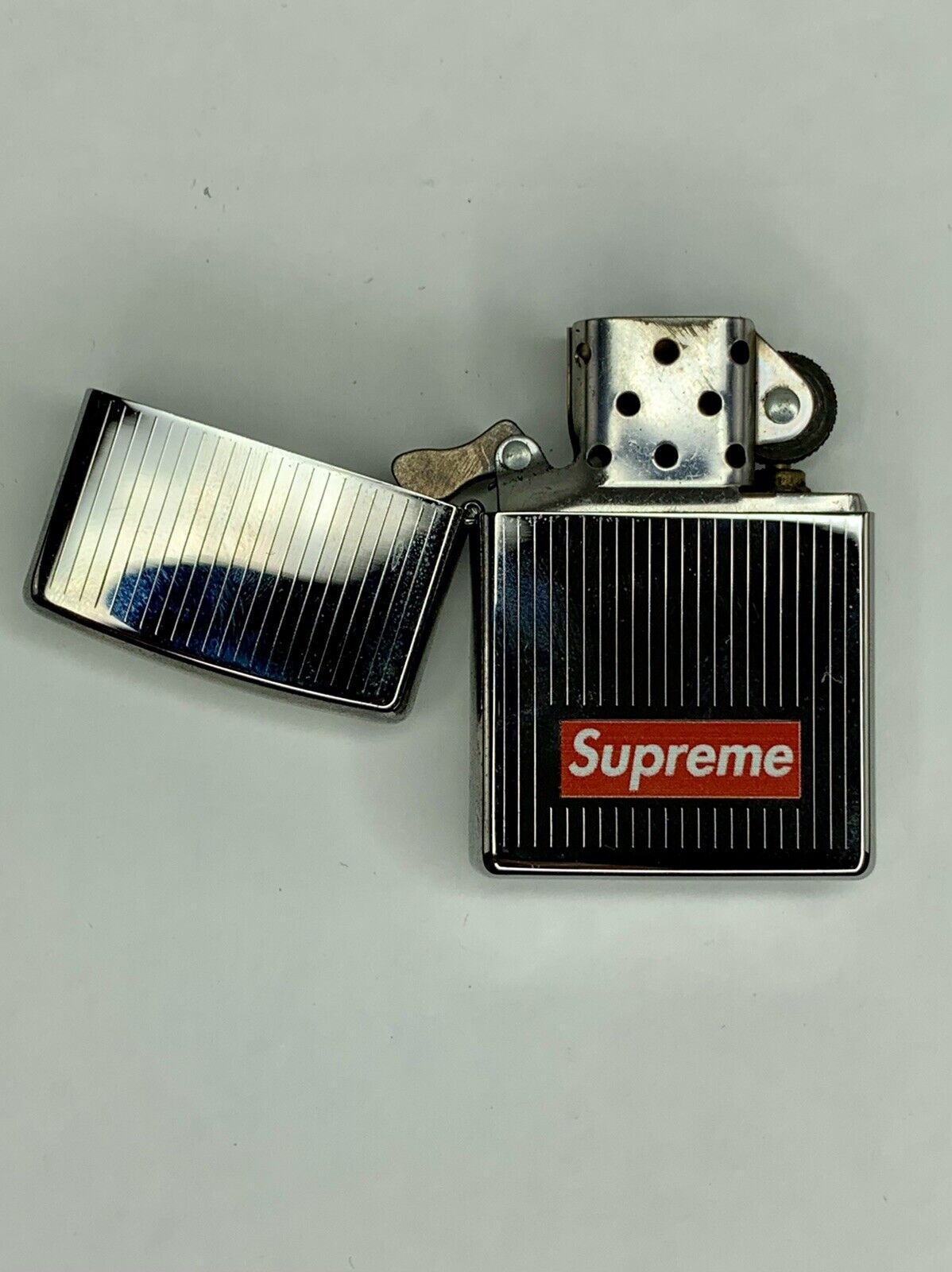 SUPREME “Striped” Silver Zippo FW15 pre-owned