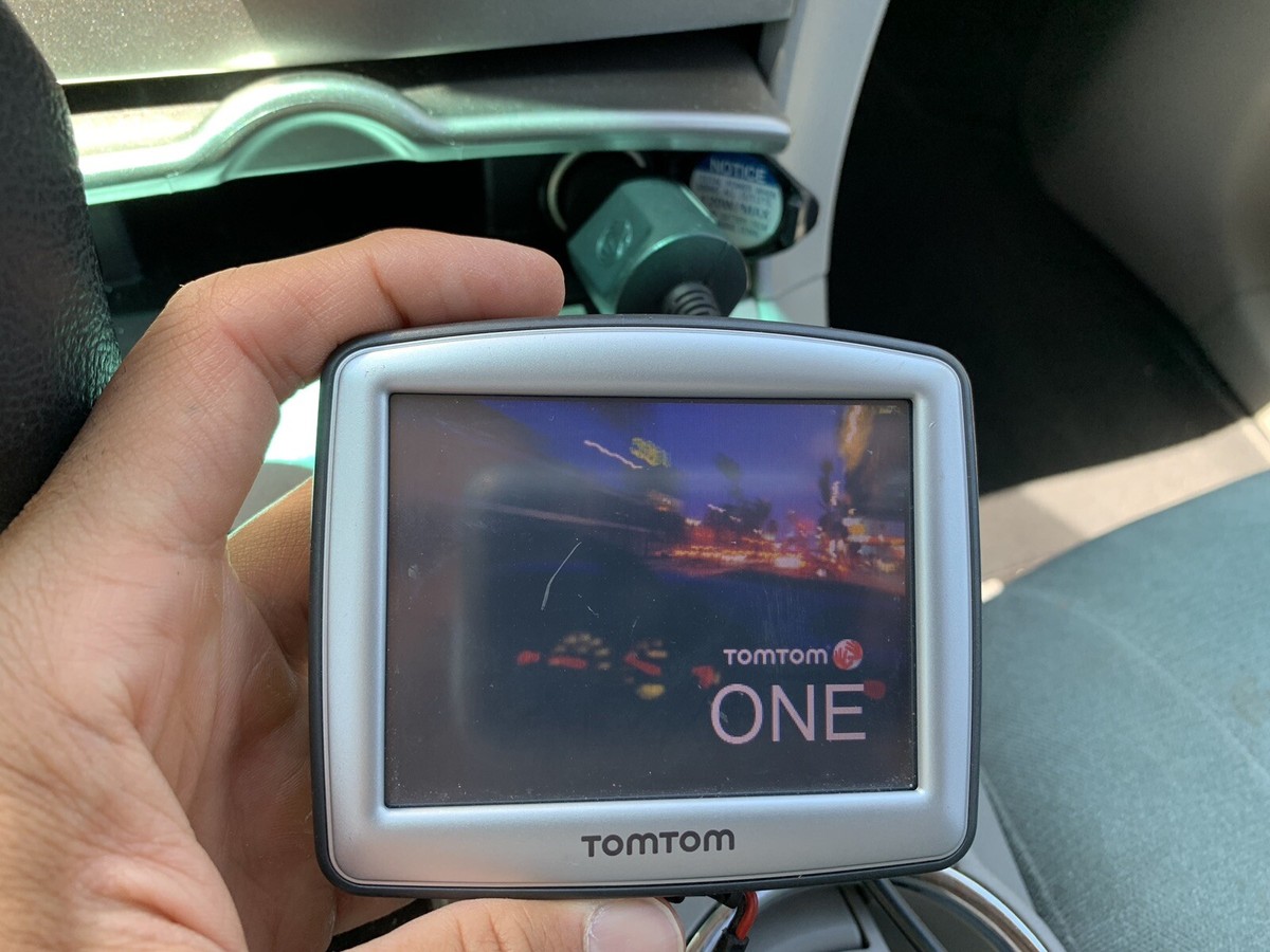 TomTom One GPS With Charging Cord Plus Extra TomTom Lot Navigation