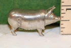 Small silverplated pig match safe, missing tail, circa 1890, American