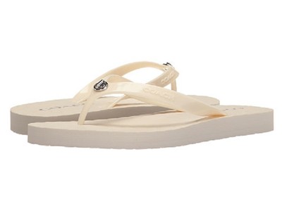 white strappy flip flops