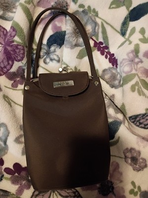 Vintage ~D.K.N.Y handbag features a kiss-lock Closure 
