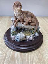 Country Artists hand painted and crafted otter with cubs (lazy days CA552)....