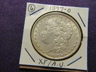 1897-O Morgan dollar in XF / A.U. condition