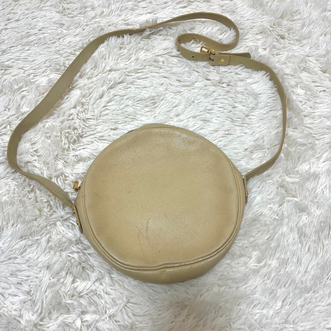 Borsa a tracolla Yves Saint Laurent vintage rotonda tinta unita beige pelle donna usata