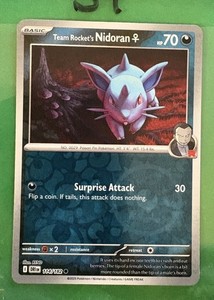 Team Rocket's Nidoran F 114/182 Sv10: Destined Rivals Reverse Holo