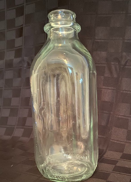 Quart milk bottle, clear glass with square shape, very old