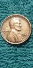 1945 s wheat penny with odd doubling by face and L on rim circulated but mint
