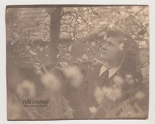 Vintage Photo of Young Woman Among Flowers Glimpse Through Nature and the Past