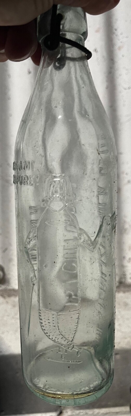 Nice rare heavy embossed “milk bottle man” sterilised swing top milk